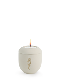 Ceramiczna mini urna Melina Creme, aksamitna, kremowa, złota róża i krzyż, świeca z pokrywką.
